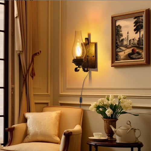 Aldridge plug-in wall sconce, clear glass chimney shade on a hand-painted black and gold base, alternate view 2