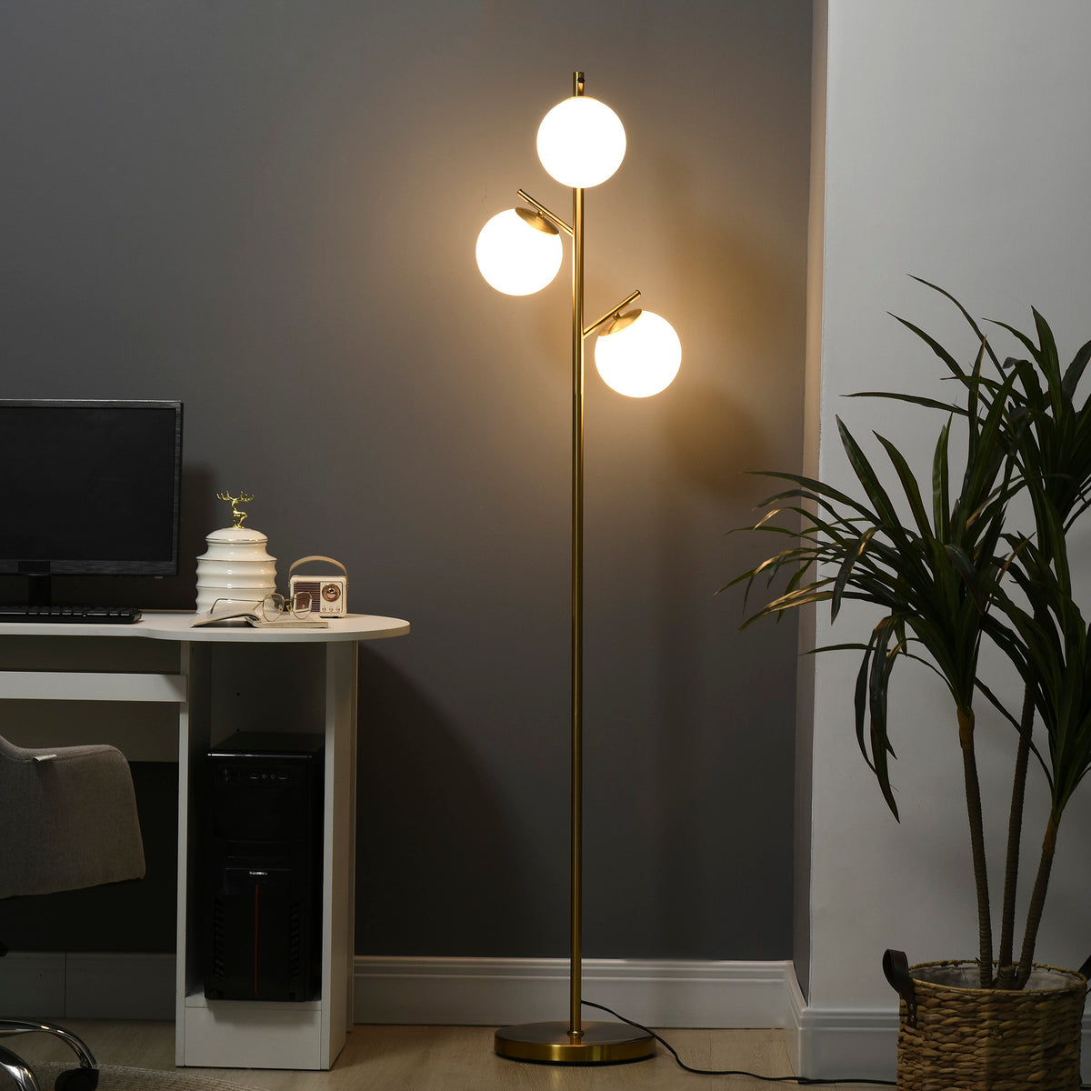 Bexley 3-light tree floor lamp with three glass globe shades on a gold-tone metal pole and round base