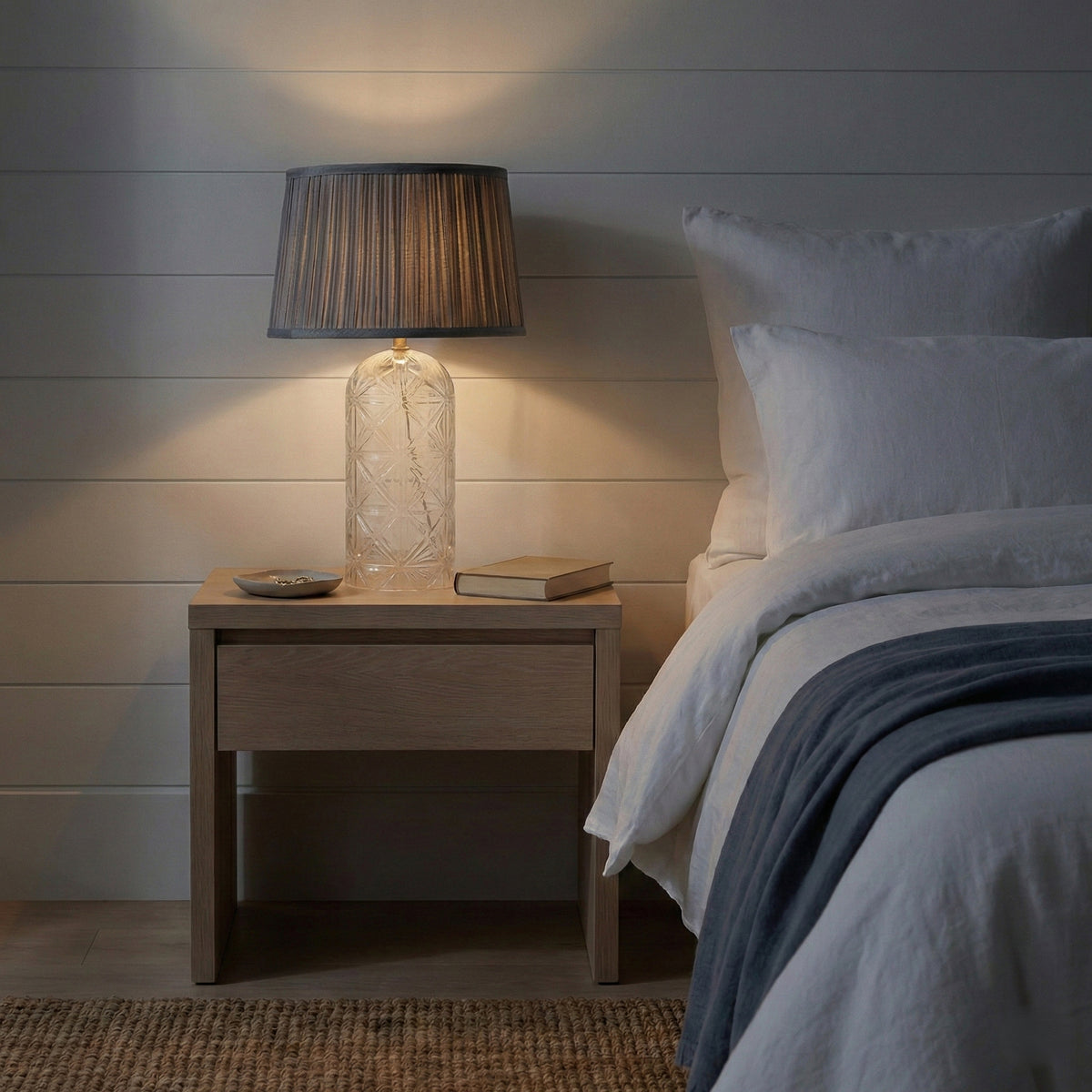Calloway textured glass table lamp with gold-finished metal base and pleated grey fabric shade
