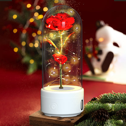 Decorative LED rose lamp under a glass dome on a lit round base, alternate view 2