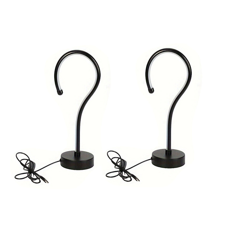 Quill question mark table lamp with curved acrylic tube on a black base, alternate view