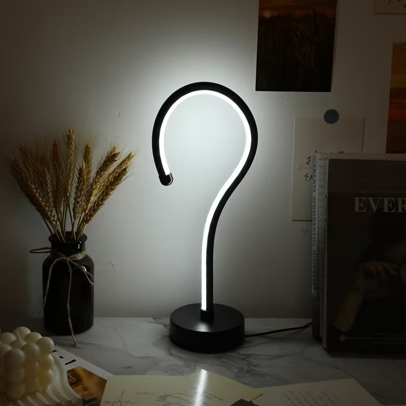 Quill question mark table lamp with curved acrylic tube on a black base, alternate view 6
