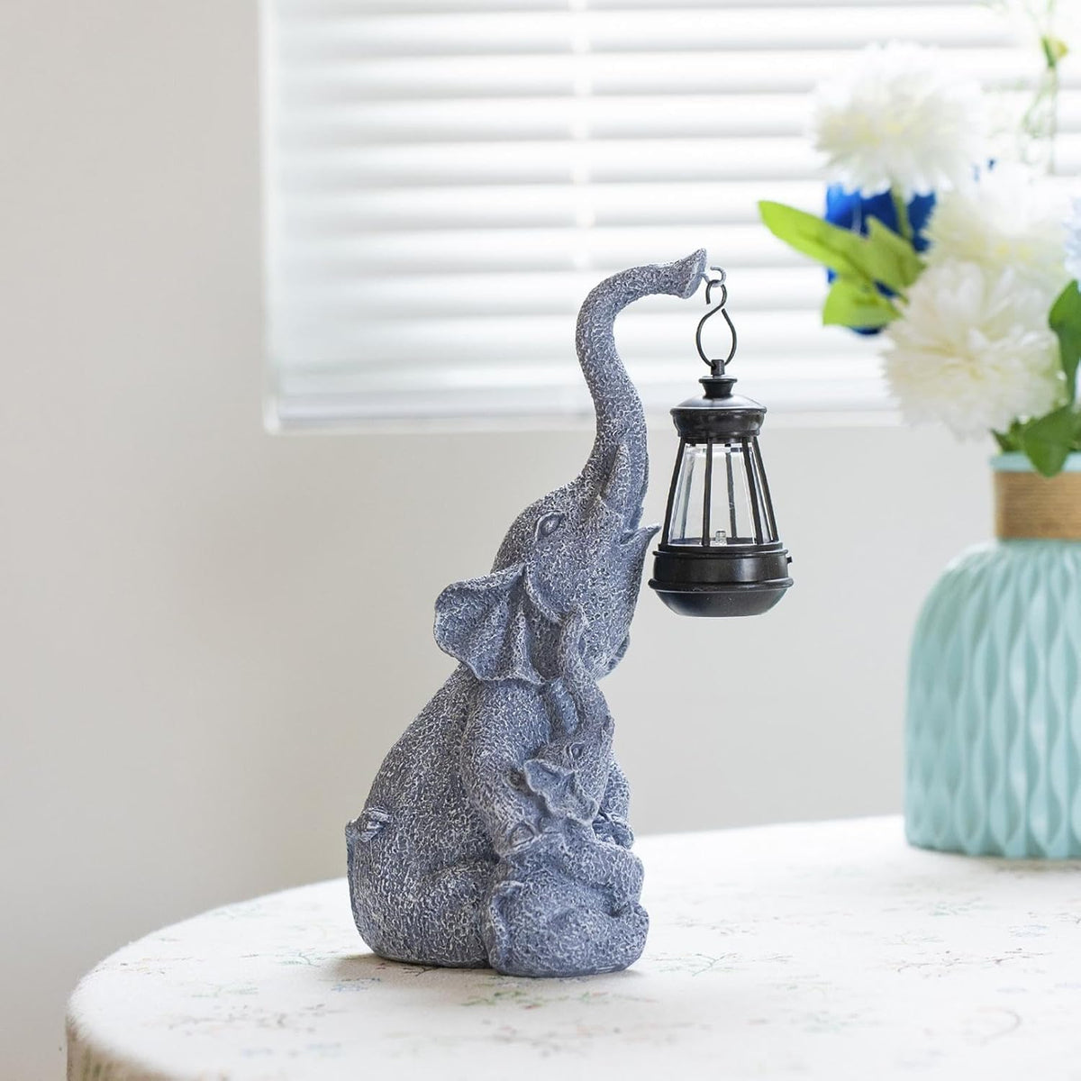 Hand-painted resin elephant figure holding a solar lantern, alternate view 2