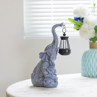 Hand-painted resin elephant figure holding a solar lantern, alternate view 2