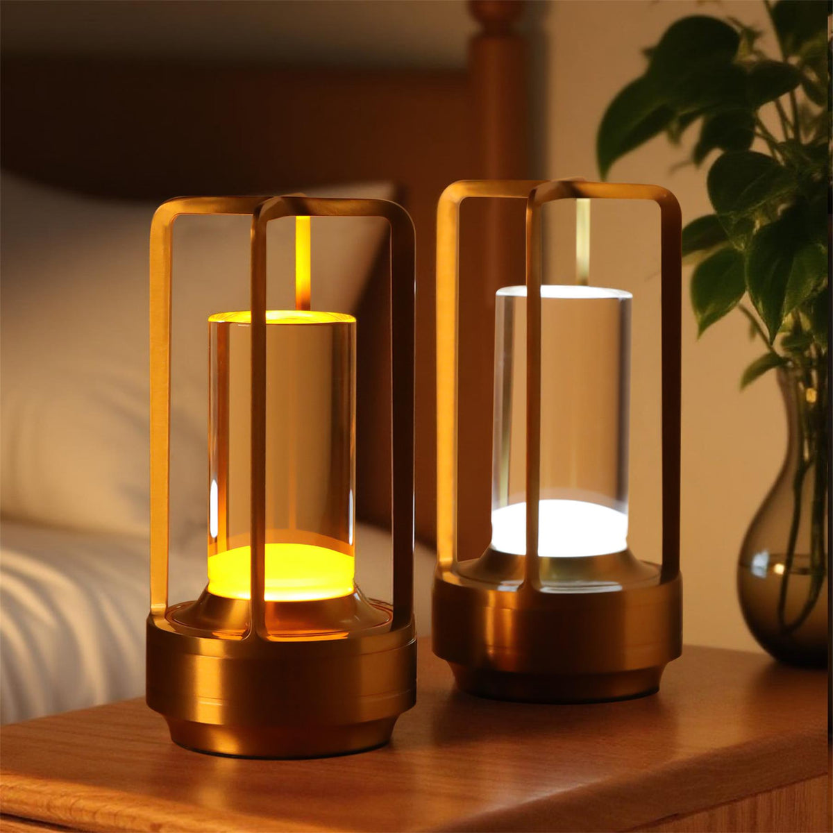 Bellamy cordless lantern table lamps in brushed aluminium with amber acrylic diffusers, shown as a pair on a bedside table