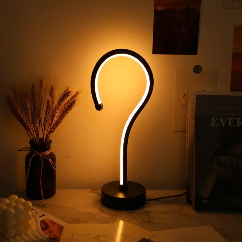 Quill question mark table lamp with curved acrylic tube on a black base, alternate view 2
