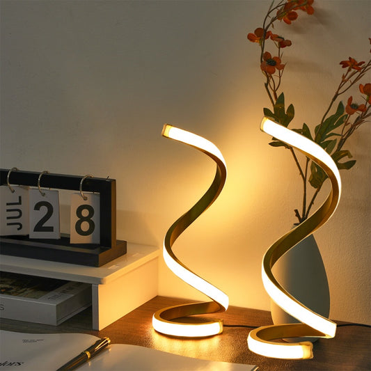 Spiral LED table lamp — a 9.8 inch S-curve of light on a round weighted base, sold as a set of two
