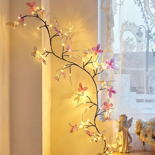 Butterfly vine lights — a lighted willow swag with maple leaves and 3D butterflies on bendable twigs