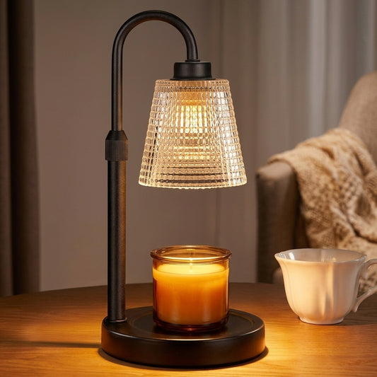 Candle warmer lamp with ribbed glass shade, curved matte black arm and round base, lit and melting a jar candle from above with no flame