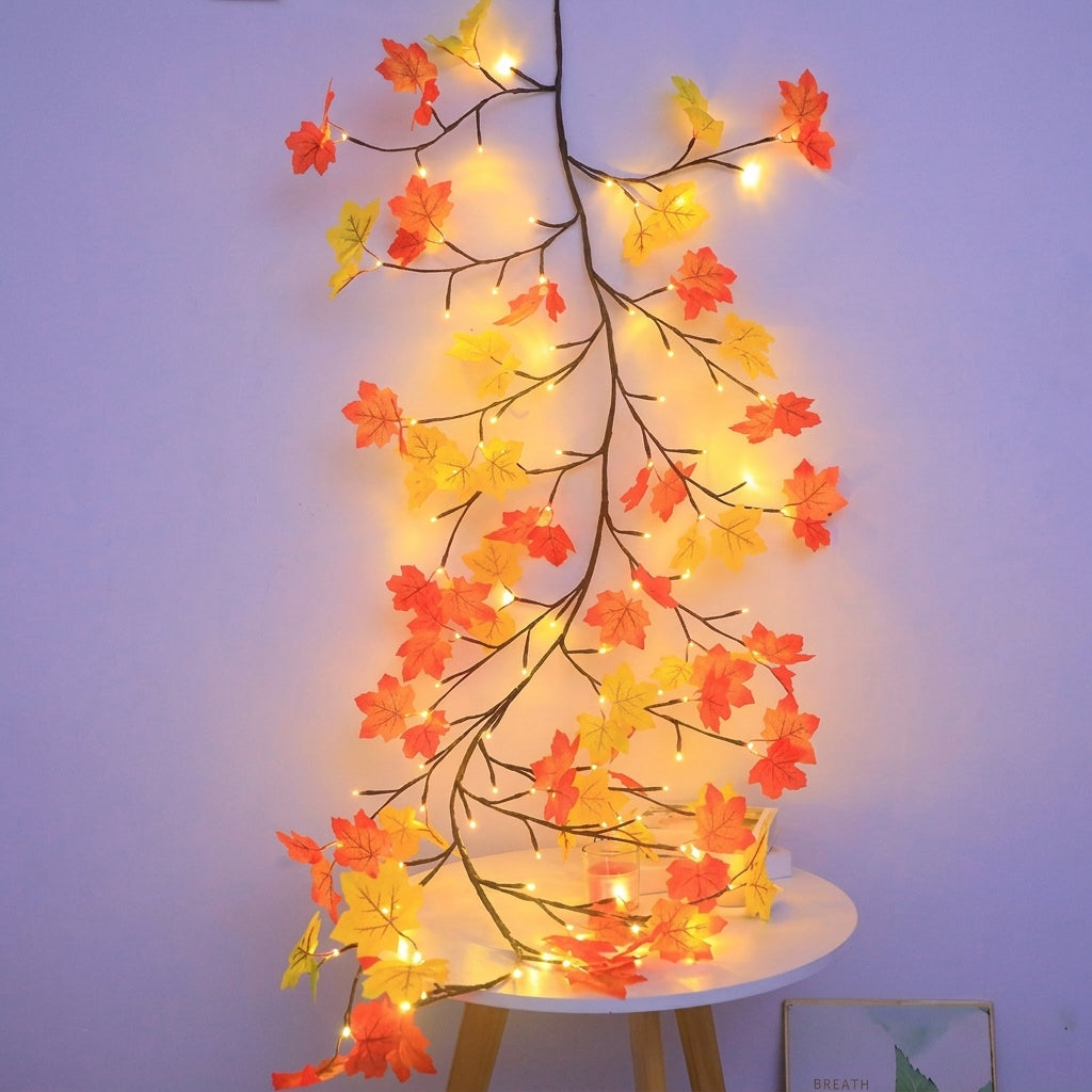 Autumn maple garland lights — a bendable LED leaf garland on copper wire with orange and yellow maple leaves