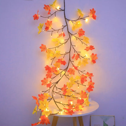 Autumn maple garland lights — a bendable LED leaf garland on copper wire with orange and yellow maple leaves