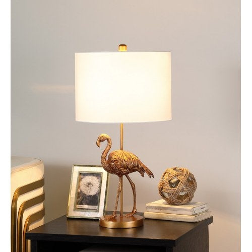 Sable flamingo table lamp with a matte gold resin flamingo figure under a white linen drum shade